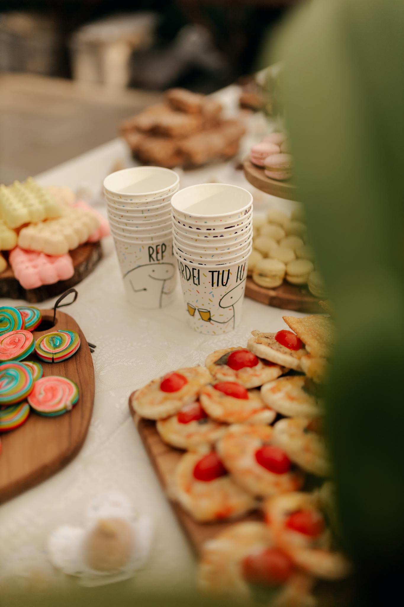 Vibrant dessert spread featuring colorful cookies and assorted pastries.